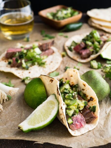 Beef tacos with lemon wedges
