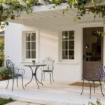 French style porch with climbing vines and bistro furniture